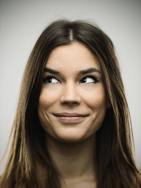 istock Excited woman smiling against gray background 638757112