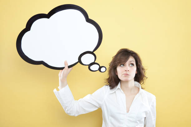 istock pretty young brunette caucasian woman thinking ideas with comic baloon 638757832