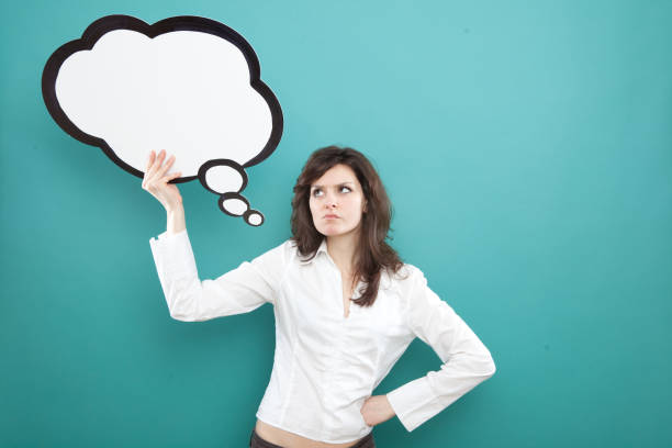 istock pretty young brunette caucasian woman thinking ideas with comic baloon 638757906