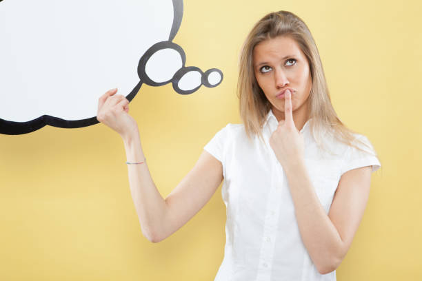 istock pretty young blond caucasian woman thinking with comic baloon 638758054