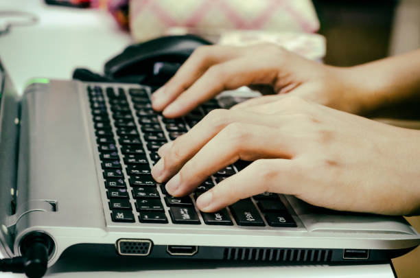 istock business woman hand typing on laptop keyboard 638758076