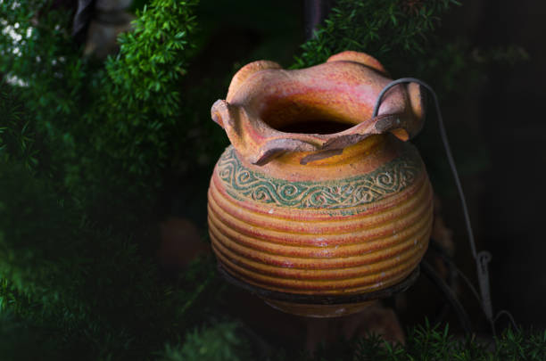 Old vintage ceramic clay pots in the garden, decorative clay vases in garden