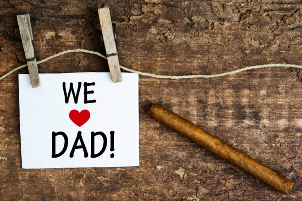 istock cigar and white sign with the words We Love Dad 638759780