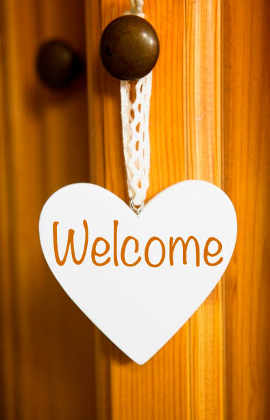 istock white wooden heart with the word Welcome 638761084