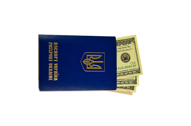 istock Ukrainian foreign passport with one hundred dollars isolated on white 638762336