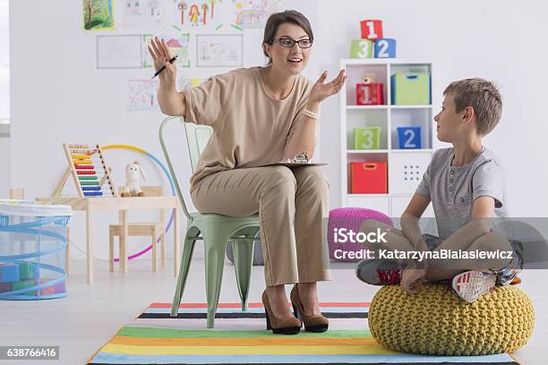 School Counselor And Pupil Stock Photo - Download Image Now - Child, Mental Health Professional, School Counselor