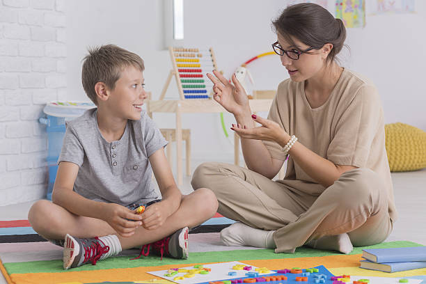 istock Elder sister teaching her brother 638766452