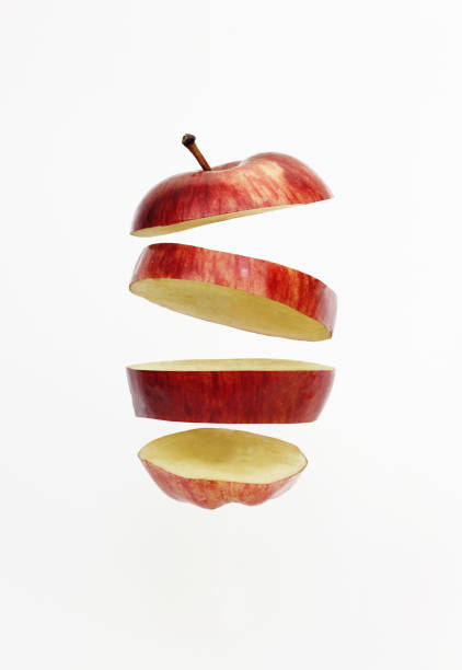 istock Fresh red golden delicious apple cut into slices floating 638767862