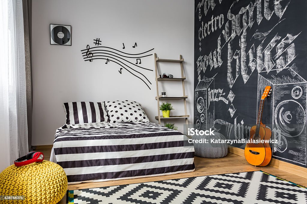 Monochrome bedroom for musician Monochrome bedroom interior for young guitar musician Bedroom Stock Photo