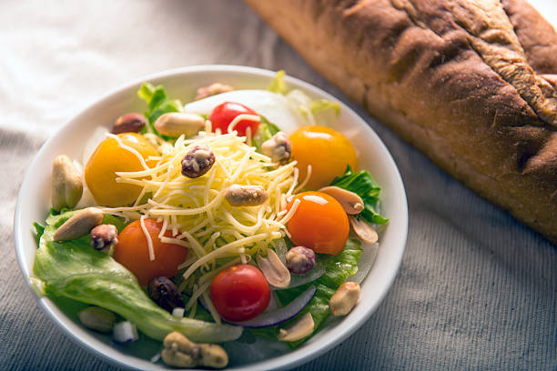 Cheese and nuts salad with baguette