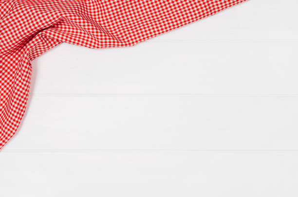 istock Top view of checkered cloth napkin on white wooden table 638768974