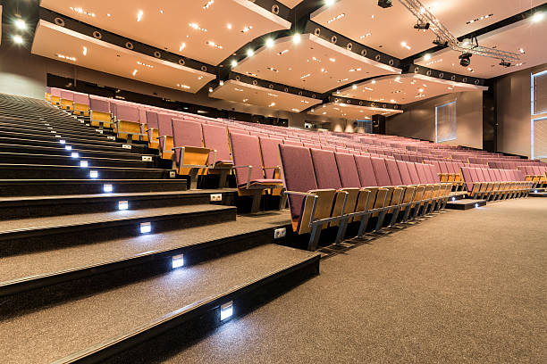 istock Lecture room with illuminated stairs 638769622