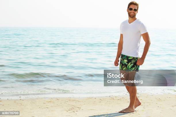 Shorts Guy On Beach Stock Photo - Download Image Now - Men, Beach, Shorts