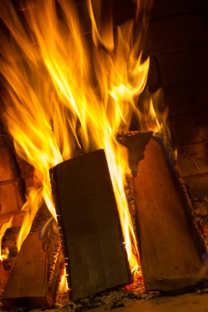 istock Burning firewood in the fireplace close up 638770858