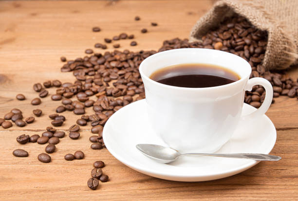 istock Cup of coffee, roasted coffee beans in sack 638771288