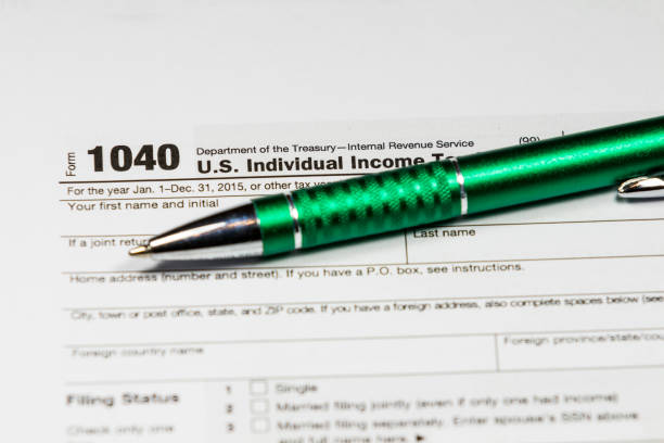 istock Tax time. Tax form with pen 638771580