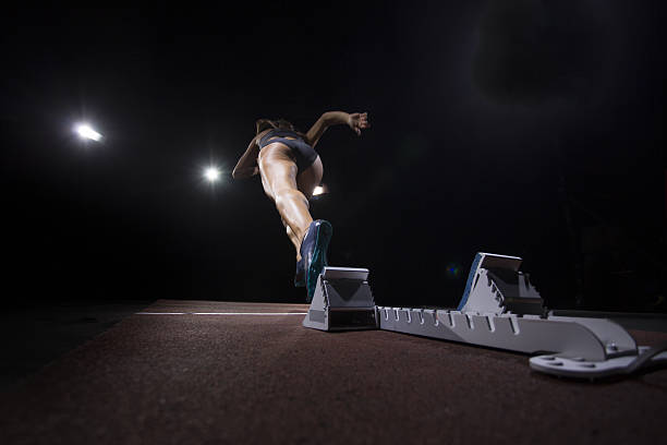 istock Female athlete running on track 638771854