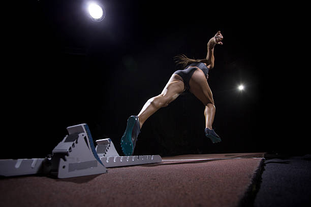 istock Female athlete running on track 638772282