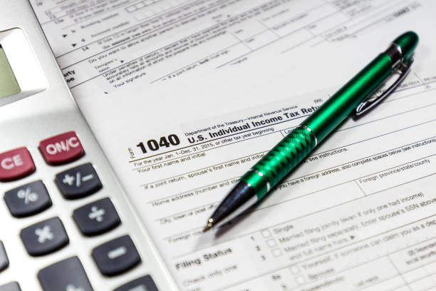 istock Tax time. Tax form with pen 638772566