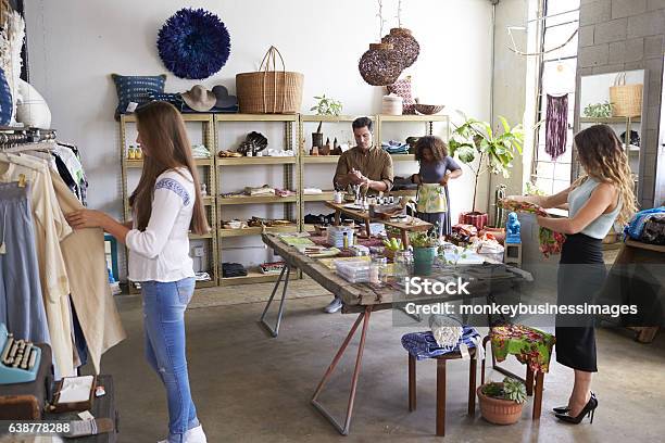Customers And Staff In A Busy Clothes Shop Stock Photo - Download Image Now - Boutique, Small Business, Owner