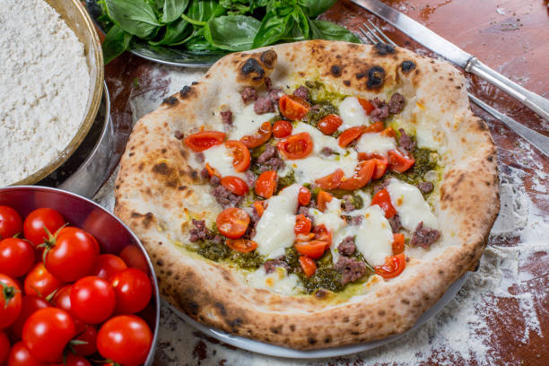 istock Italian traditional pizza with mozzarella, sausage, tomato 638778492