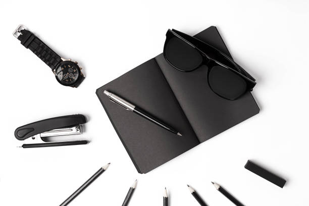 istock Blank notepad with clips, pens and glasses flat lay. 638778684
