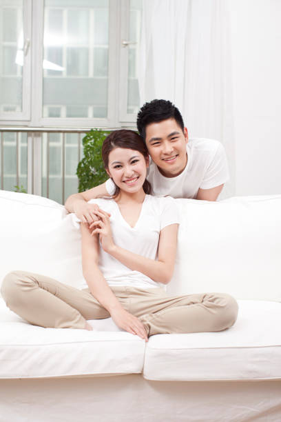 istock Young couple sitting in couch 638780006
