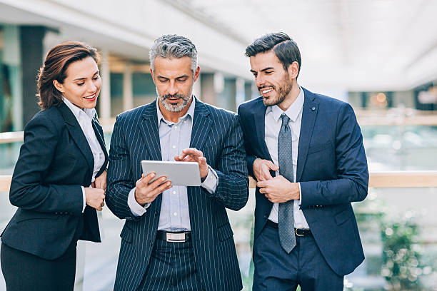 istock Mixed age business team with digital tablet 638780394