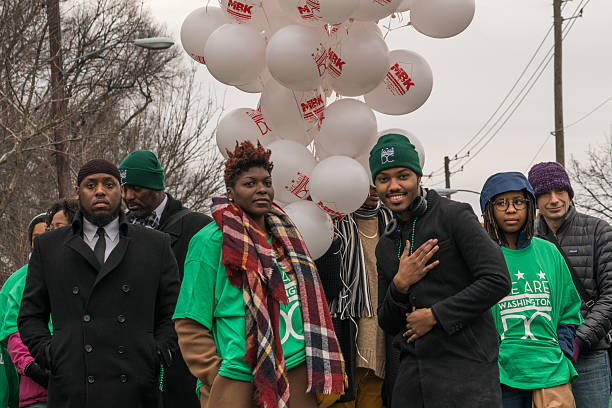 We Are Washington Washington, DC - January 16, 2017: Supporters of Mayor Bowser participate in the annual Martin Luther King, Jr. Day Peace Walk and Parade. martin luther king jr day stock pictures, royalty-free photos & images