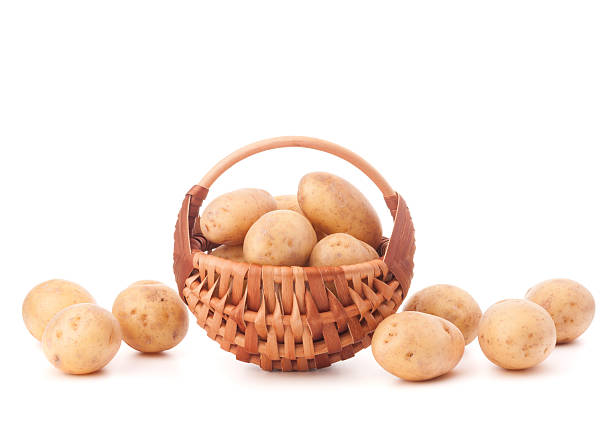 istock Potato tuber  in wicker basket isolated on white background 638784272