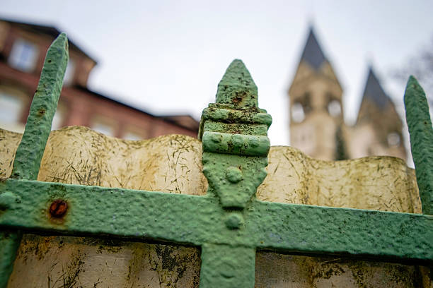 istock Fence with a blurry church in the background 638784804