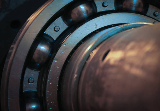 Part of bearing holder on the shaft in blue light