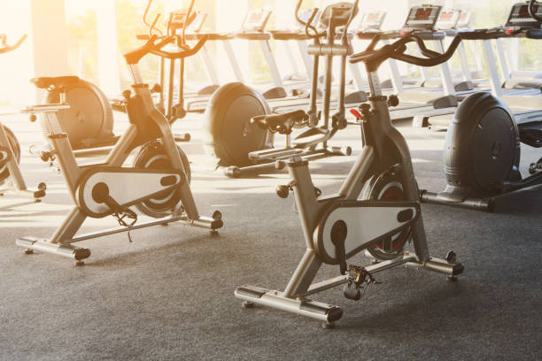 istock Modern gym interior with equipment, fitness exercise bikes 638784956