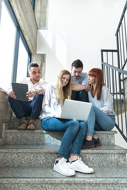 istock group of colleagues working on the steps 638785324