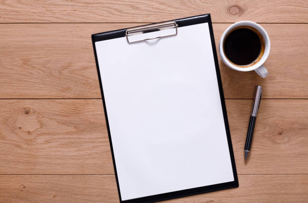 istock Mockup for checklist, note paper and coffee on wood background 638785984