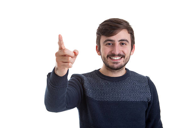 istock Smiling happy young man pointing at you 638787144