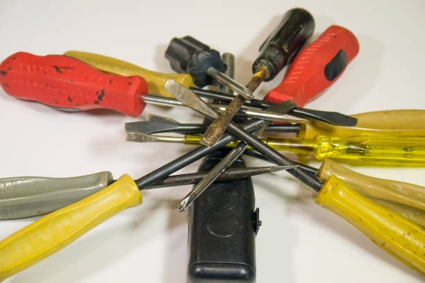 istock Old colorful screwdrivers on a white background closeup 638787320