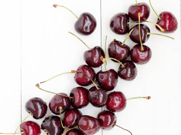 istock Ripe cherry on white wooden table. Top view 638788318