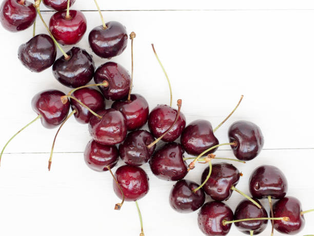 istock Ripe cherry on white wooden table. Top view 638788368