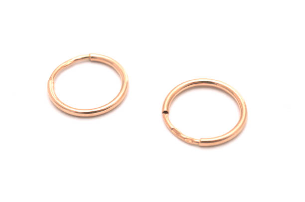 istock gold earrings isolated on white 638788850