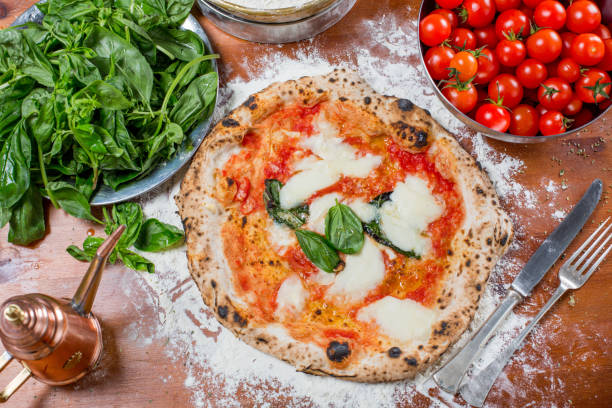 istock Traditional italian pizza with mozzarella, tomato and basil, on 638790142
