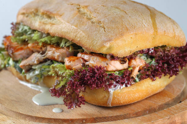 istock Tasty salmon steak sandwich in a ciabatta 638792316