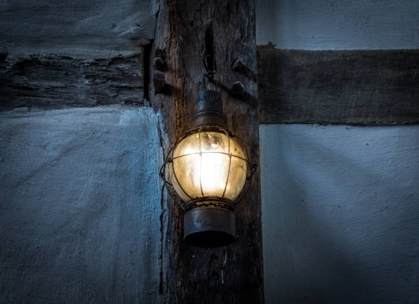 istock The old kerosene lamp on a wall in dark room 638793096