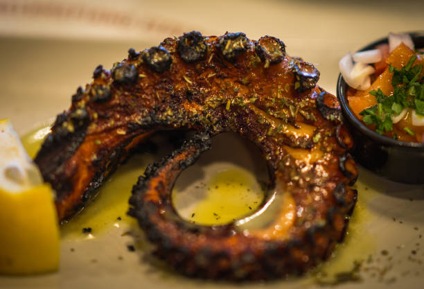 istock Grilled octopus and fresh vegetable salad 638793102