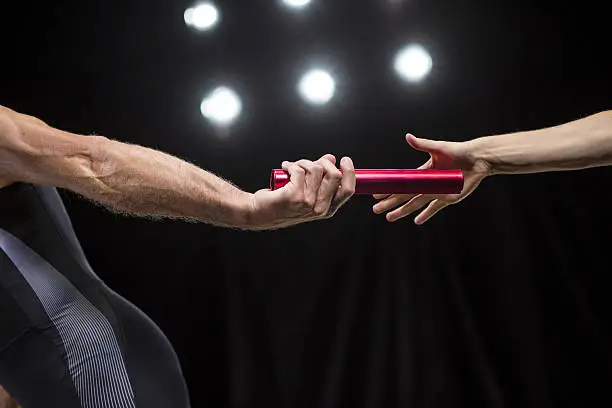 Photo of Runners passing baton