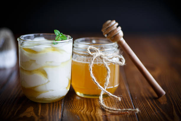 Greek yogurt with honey on a wooden table