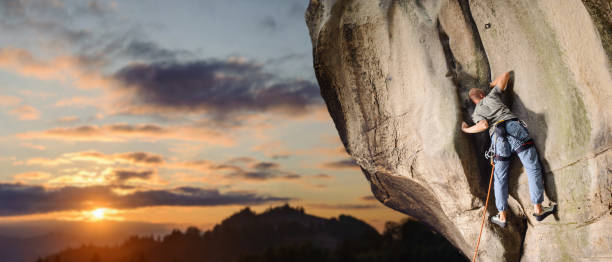 istock Male climber climbing big boulder in nature with rope 638797246