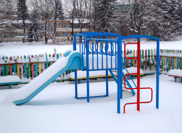 istock Children's playground covered with snow 638797826