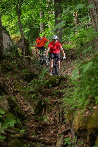 istock Couple Mountain Biking on Single Track in the Forest 638798648