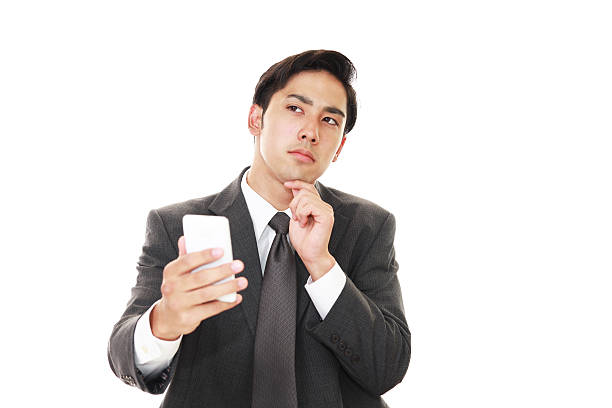 istock Businessman holding a smart phone 638802760